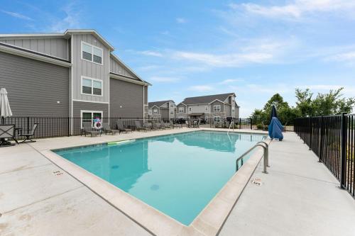 a swimming pool in a villa with a house at Spring Special Hot Tub King Beds No Steps No Dog Fee in Branson