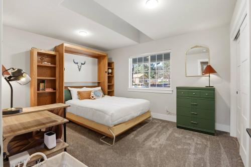 a bedroom with a bed and a green dresser at The Fairway To Heaven in Rathdrum