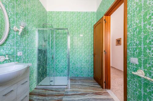 a bathroom with a shower and a sink at Villa dei Domenicani in Copertino
