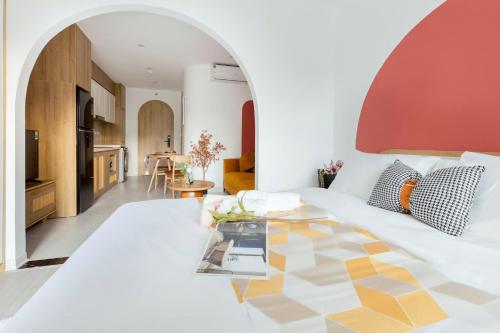 a living room with a white couch and a table at Artsy Boutique Studio in Hanoi