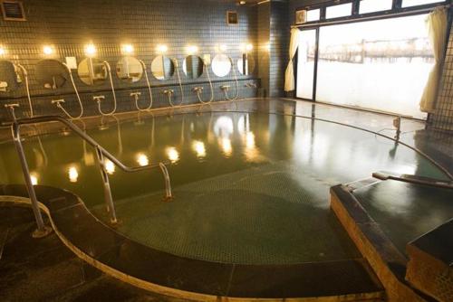 an empty swimming pool with lights on the floor at Villa Inawashiro in Inawashiro