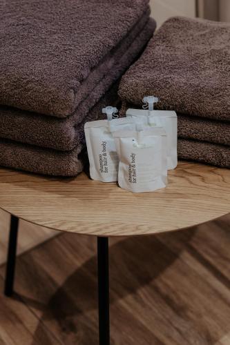 a table with three rolls of toilet paper on it at Auerhiasbauer in St. Wolfgang