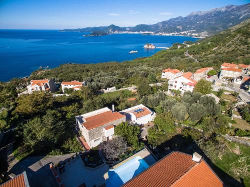 an aerial view of a town on a hill next to the ocean at Villa Narcissus Montenegro KO Sveti Stefan in Sveti Stefan