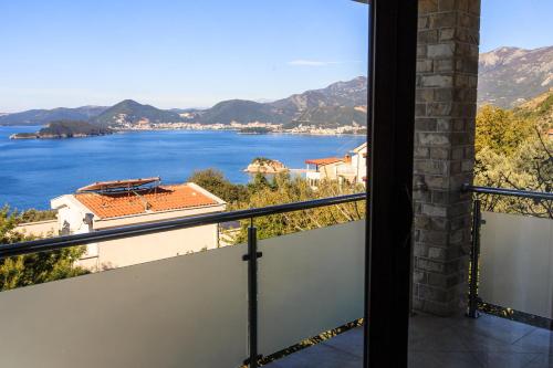 a balcony with a view of the water at Villa Narcissus Montenegro KO Sveti Stefan in Sveti Stefan