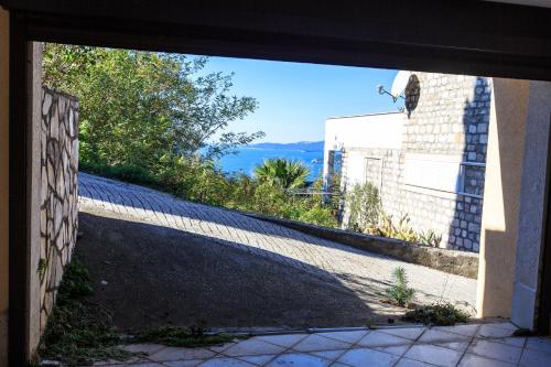 an open door of a building with a view at Villa Narcissus Montenegro KO Sveti Stefan in Sveti Stefan