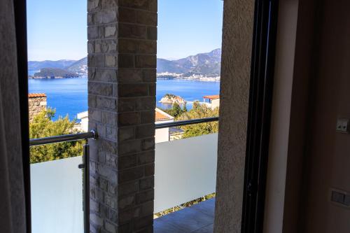 a view of the water from a window at Villa Narcissus Montenegro KO Sveti Stefan in Sveti Stefan