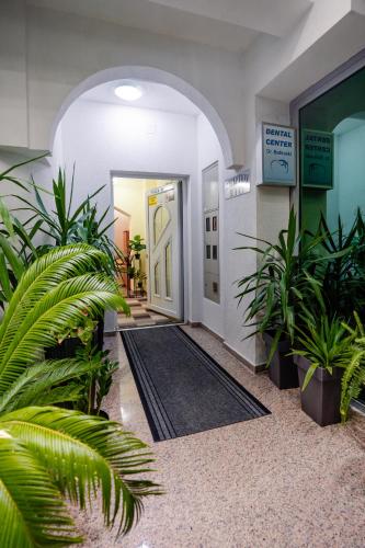 an entrance to a building with plants in a hallway at Villa Maki in Ohrid