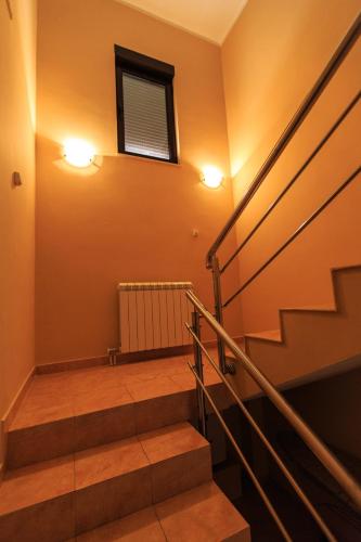a set of stairs in a building with two lights at Villa Narcissus Montenegro KO Sveti Stefan in Sveti Stefan