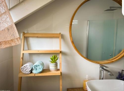 a bathroom with a sink and a mirror at Home for Air -- 9 minutes from sea of Galilee in Giv'at Yo'av