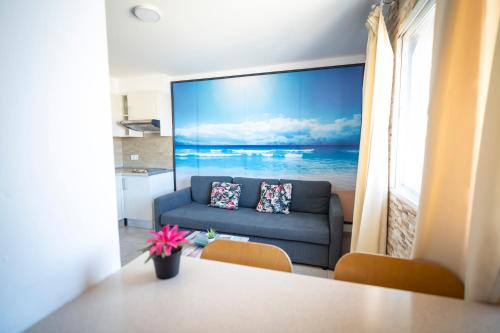 a living room with a couch and a table at Edificio Prieto VIV 4 in Puerto del Rosario