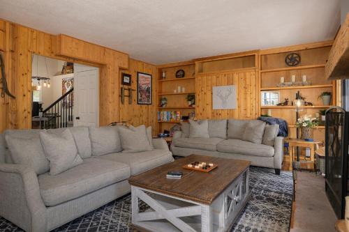 a living room with two couches and a coffee table at 1126 Western Road in Grand Lake
