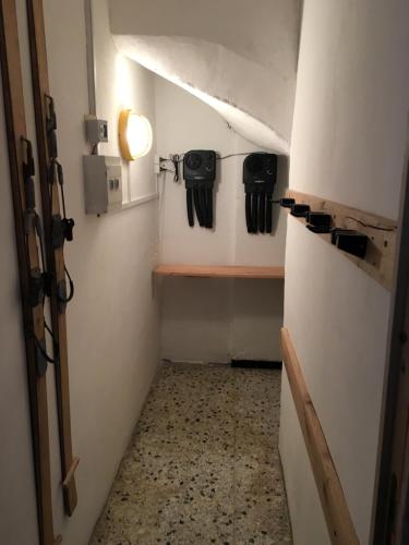 a small room with a hallway with a door and a room with a room at Le grenier des rêves in Les Deux Alpes