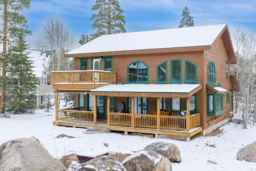 a house in the snow with snow at 21 GCR 4435 in Grand Lake