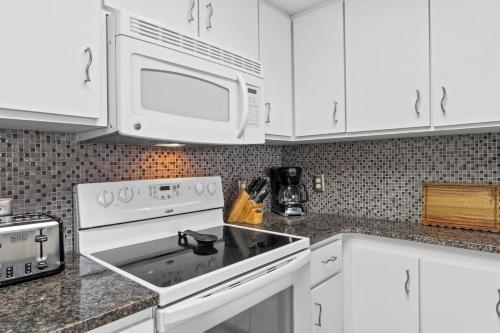 Gulf-Front Surf Club Condo 2BR, Spacious Balcony, Peaceful East End Beach Access photo 11
