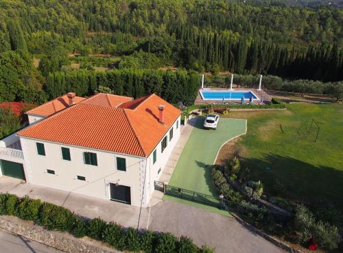 an overhead view of a house with an orange roof at Villa Nature Retreat in Gruda