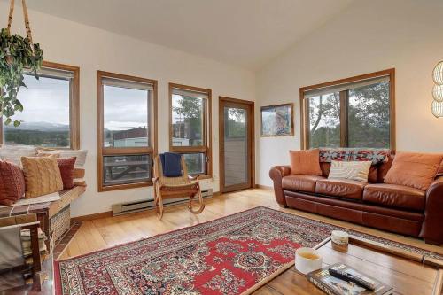 a living room with a couch and a table at 534 Sun River #8 in Fraser