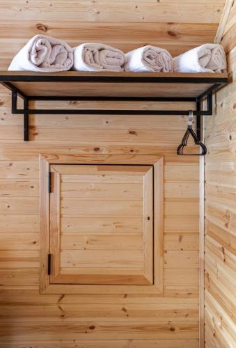 a room with towels on a shelf in a sauna at SetAura Kazbegi in Kazbegi