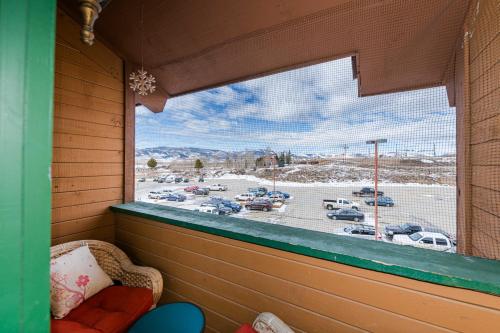 a window in a room with a view of a parking lot at 645 Silvercreek Inn Room in Granby