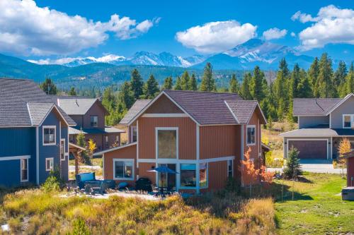 a row of houses with mountains in the background at 74 Alder Brook in Fraser