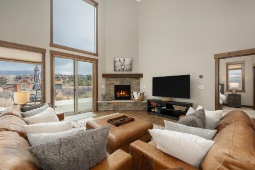 a living room with a couch and a fireplace at 74 Alder Brook in Fraser