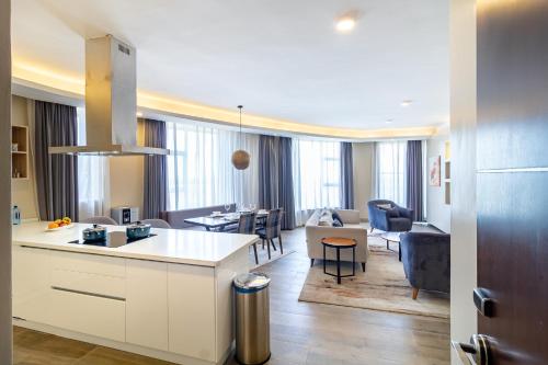 a kitchen and living room with a kitchen and a living room at A Scenic Escape within Nairobi in Nairobi