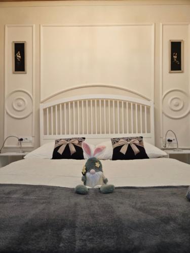 a stuffed bunny sitting on top of a bed at Apartmán Marína in Banská Štiavnica