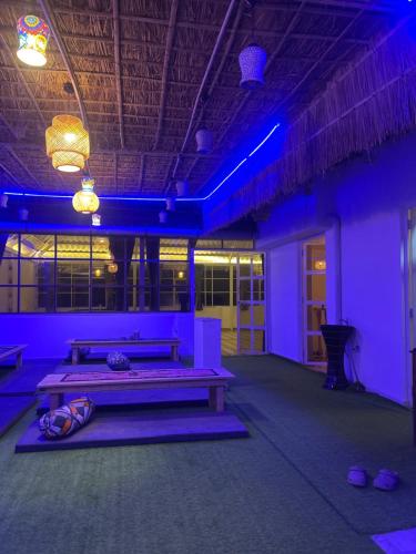 a room with purple lights in a building at Vista villa in Pushkar