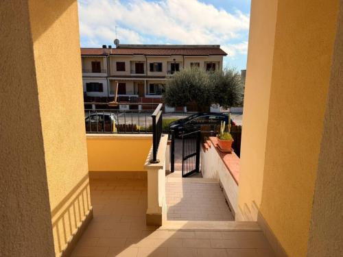 a balcony with a view of a building at Sperlonga Paradise Central House in Sperlonga