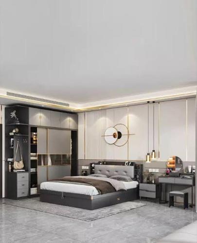 a bedroom with a large bed and a desk at روف كامل خصيصا لك in Madīnat ash Shurūq