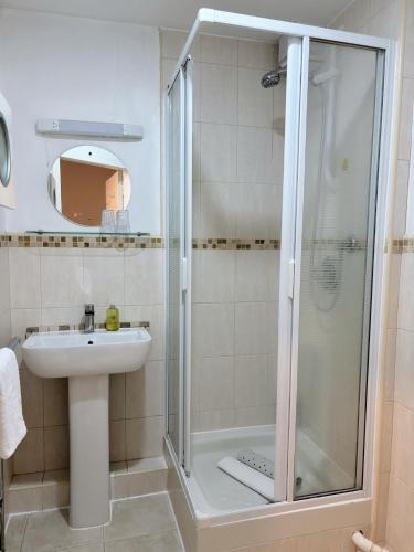 a bathroom with a shower and a sink at Hanover House in Edinburgh