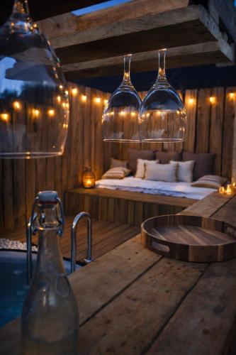 a room with a bed and a table and lights at La bergerie des petits loups in Montagnac-la-Crempse