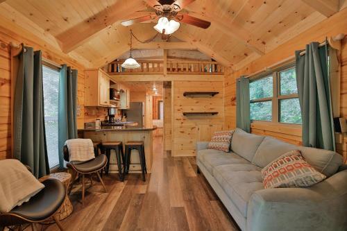 a living room with a couch and a kitchen at Bryce Cabin Lookout Mtn Tiny Home W Swim Spa in Chattanooga
