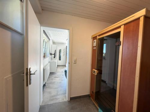 a hallway with a door leading to a room with a hallway at Ferienhaus in der Rhön Sitzmann in Bischofsheim an der Rhön
