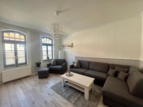 a living room with a couch and a table at Ferienwohnung Muranko in Bad Doberan
