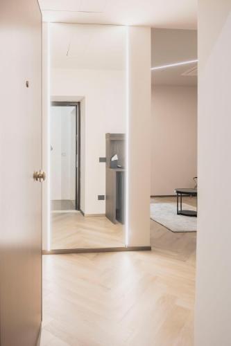 an empty room with a mirror and a table at barneys design apartment in Taranto