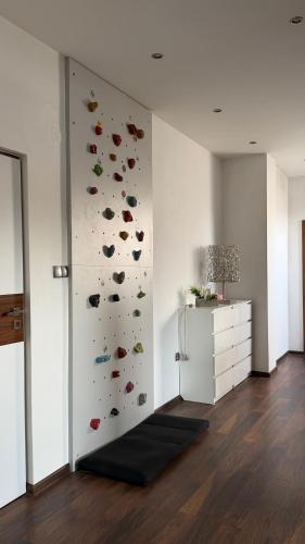a room with a wall with a climbing wall at Apartament Widok in Nowy Targ