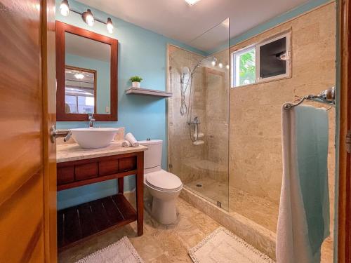 a bathroom with a toilet sink and a shower at 1 min walk beach,bars,grocery in Punta Cana