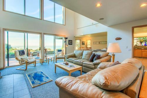 a living room with a couch and a table at Webb House in Valley Crossing