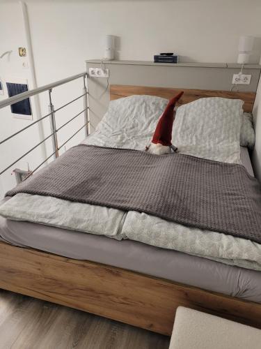 a bed with a santa hat on top of it at BEM MINI STUDiO in Budapest