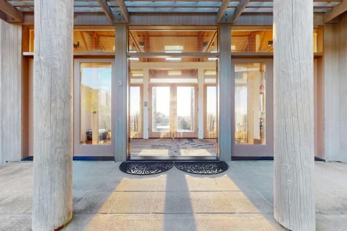 a building with columns in the middle of a room at Del Mar Meadow in Sea Ranch