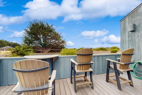 two chairs and a table on a deck at Ocean Star in Sea Ranch