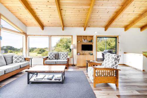 a living room with a couch and a table at Casa Contenta in Gualala