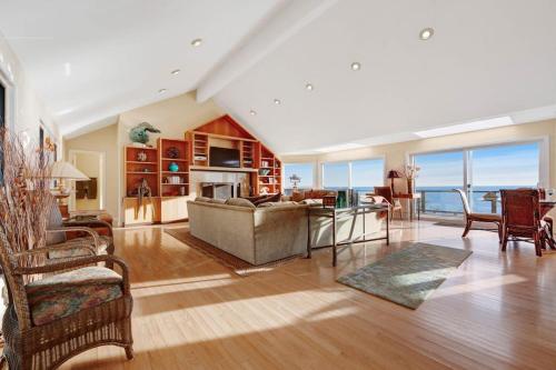 a living room with a couch and a table at The Cliff House in Gualala