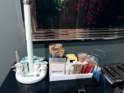 a counter top with a bunch of products on it at The Gables Hotel by Cherish Lewis Blackpool in Blackpool