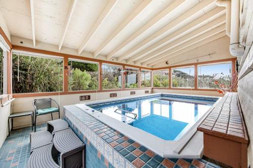 a swimming pool in a house with a ceiling at Gualala Harmony House in Gualala