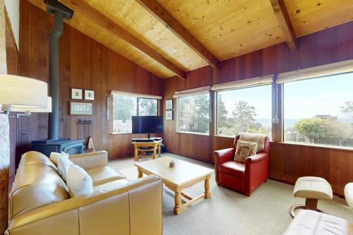 a living room with a couch and a table at Rainbow's End in Valley Crossing