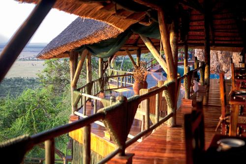 a porch of a building with a view of the wilderness at Mbali Mbali Soroi Serengeti Lodge in Banagi