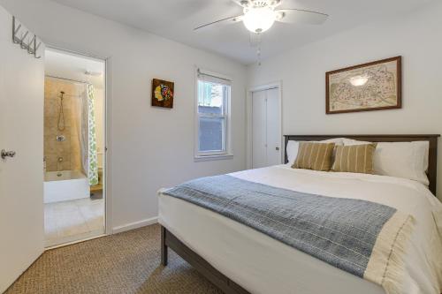 a bedroom with a large bed and a bathroom at Spacious Chicago Group Home! Walk to Train & Eats in Chicago