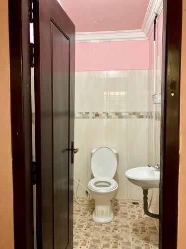 a bathroom with a toilet and a sink at Arecrata in Phnom Penh