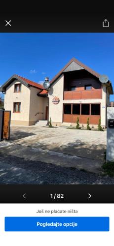 a page of a website with a building at Vila&Apartments Helena in Kolašin